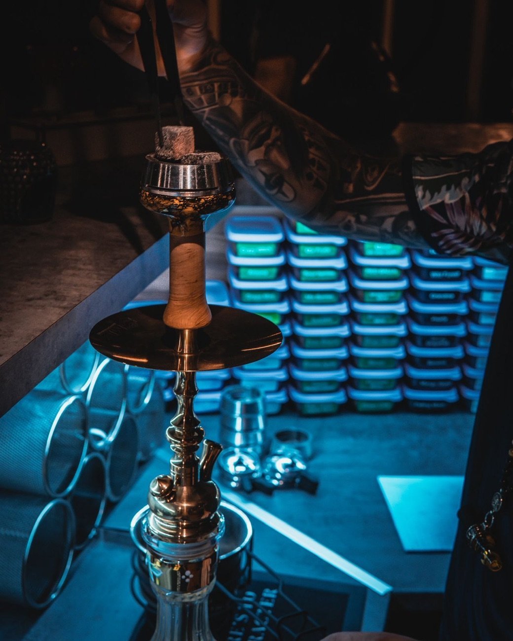 Preparing the coals under blue light